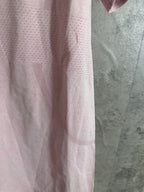 Pink short-sleeve T-shirt side view, stitched hem and texture