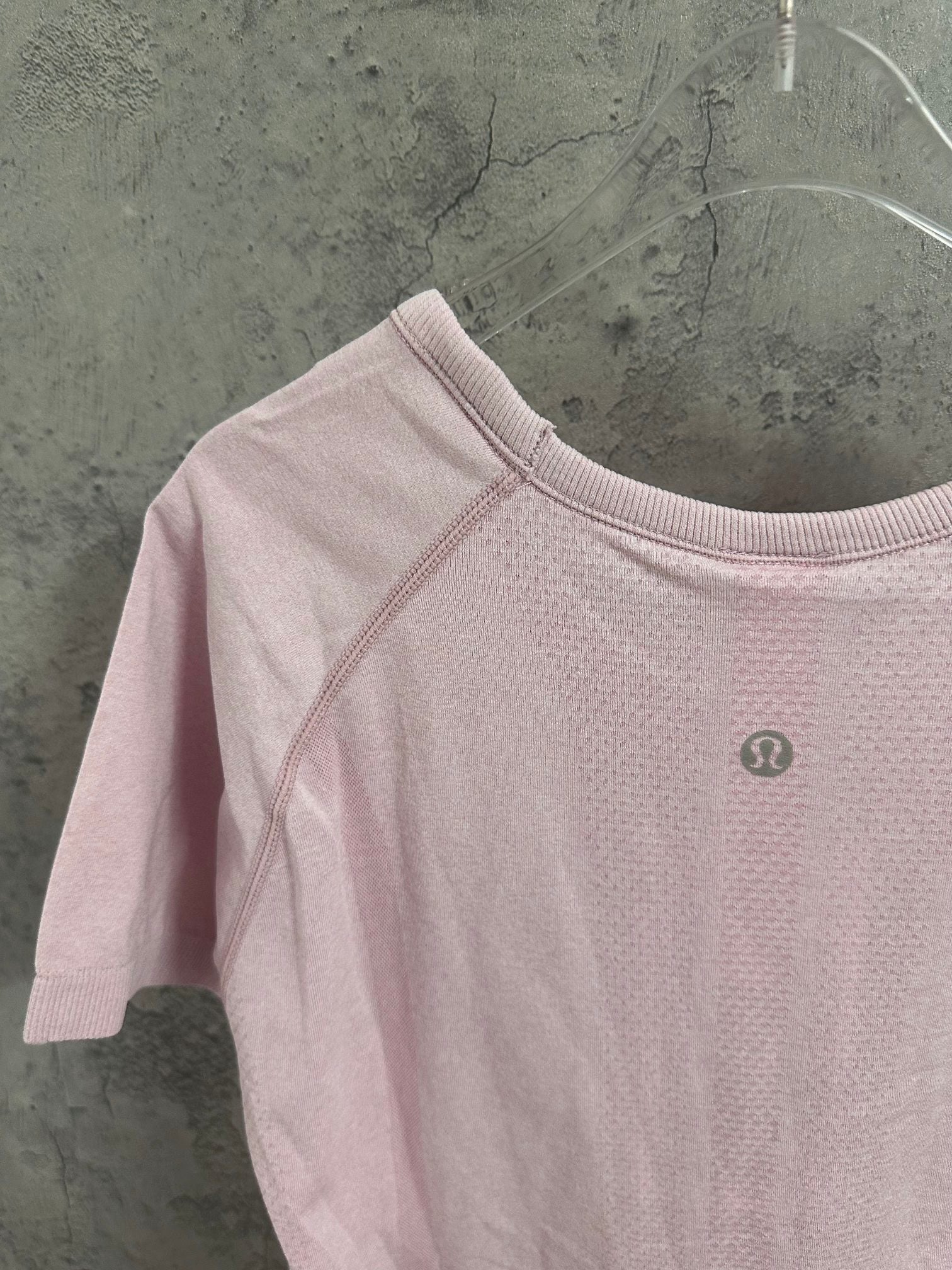 Pink raglan T-shirt with crew neck and small chest logo badge