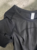 Dark heather T-shirt sleeve and shoulder seam with crew-neck collar