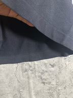 Dark heather T-shirt fabric close-up showing smooth knit texture