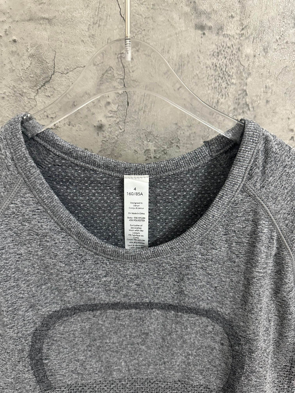 Kids gray heather T-shirt neckline with size label at center front