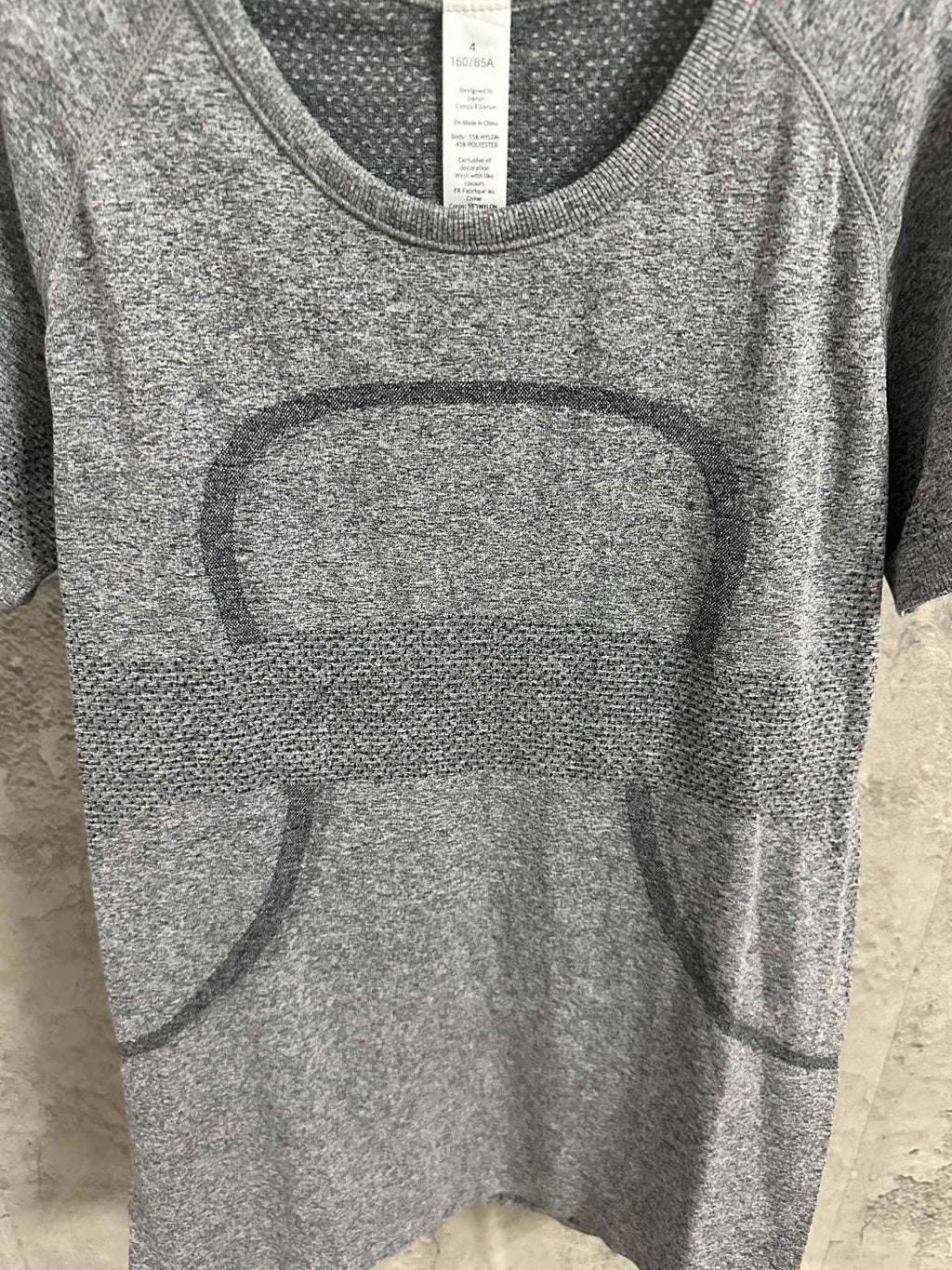 Kids gray heather T-shirt close-up of neckline and large front graphic panel