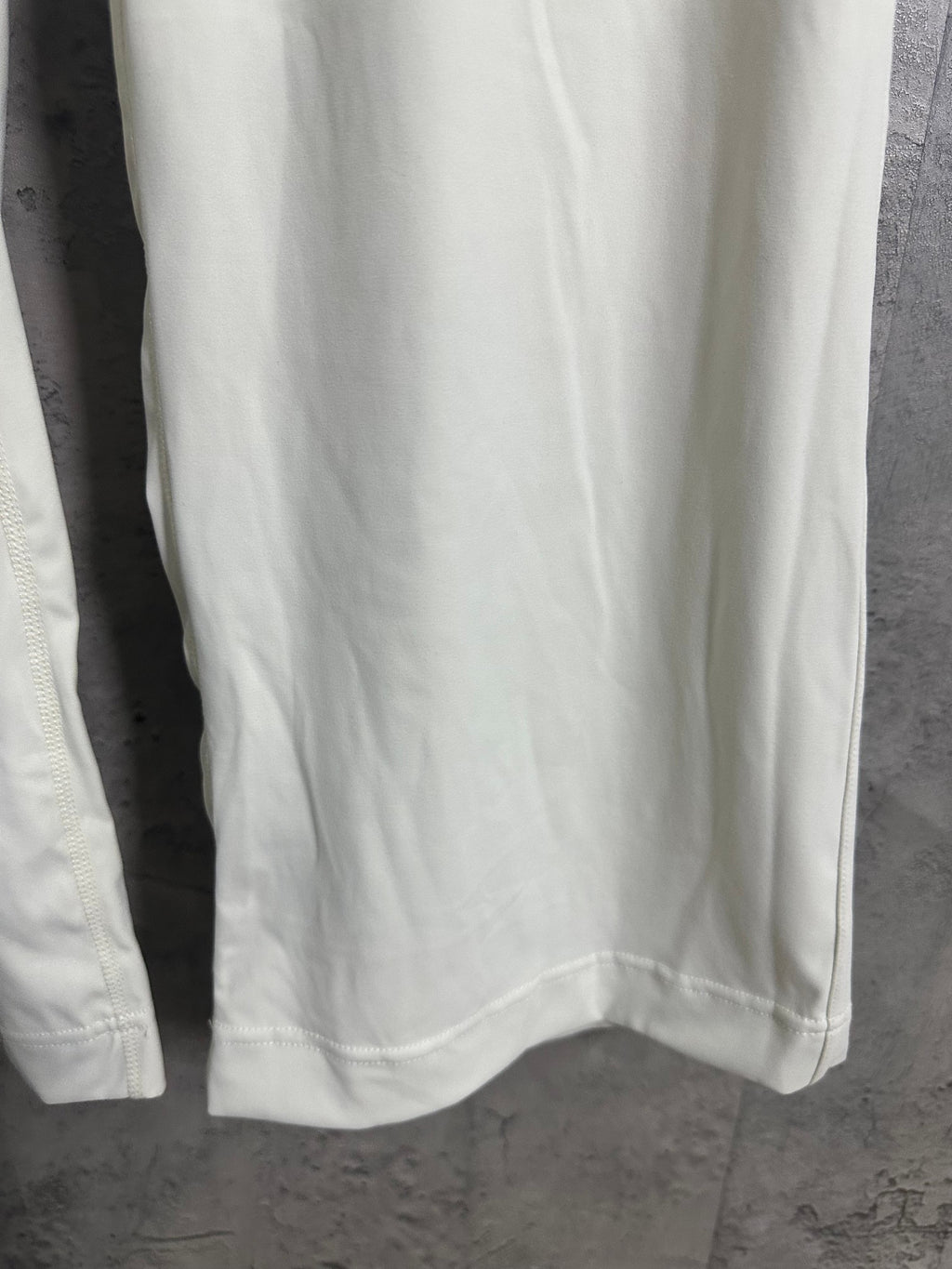 White pants back view with curved yoke seam and straight hem