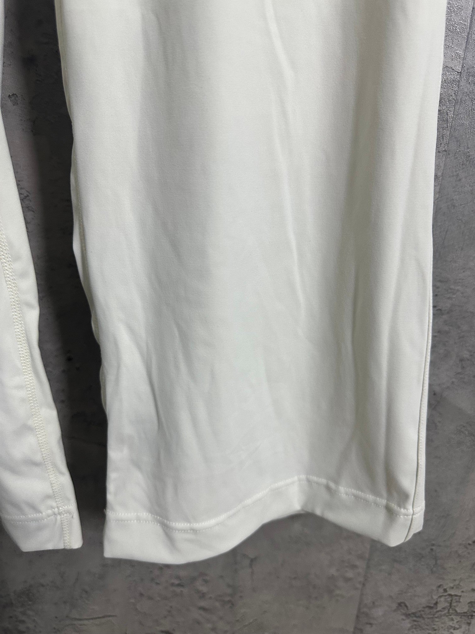 White pants showing side seam and straight hem