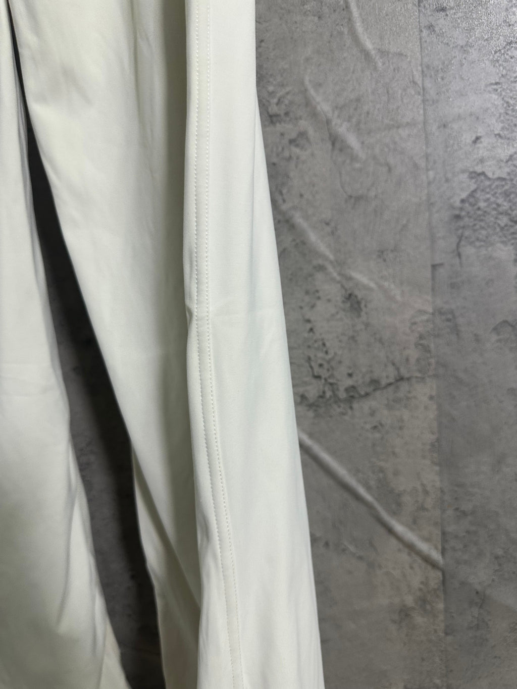 White pants side view with vertical seam and relaxed leg