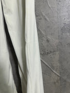 White pants side view with vertical seam and relaxed leg