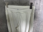White trousers back view with yoke seam and stitched hem