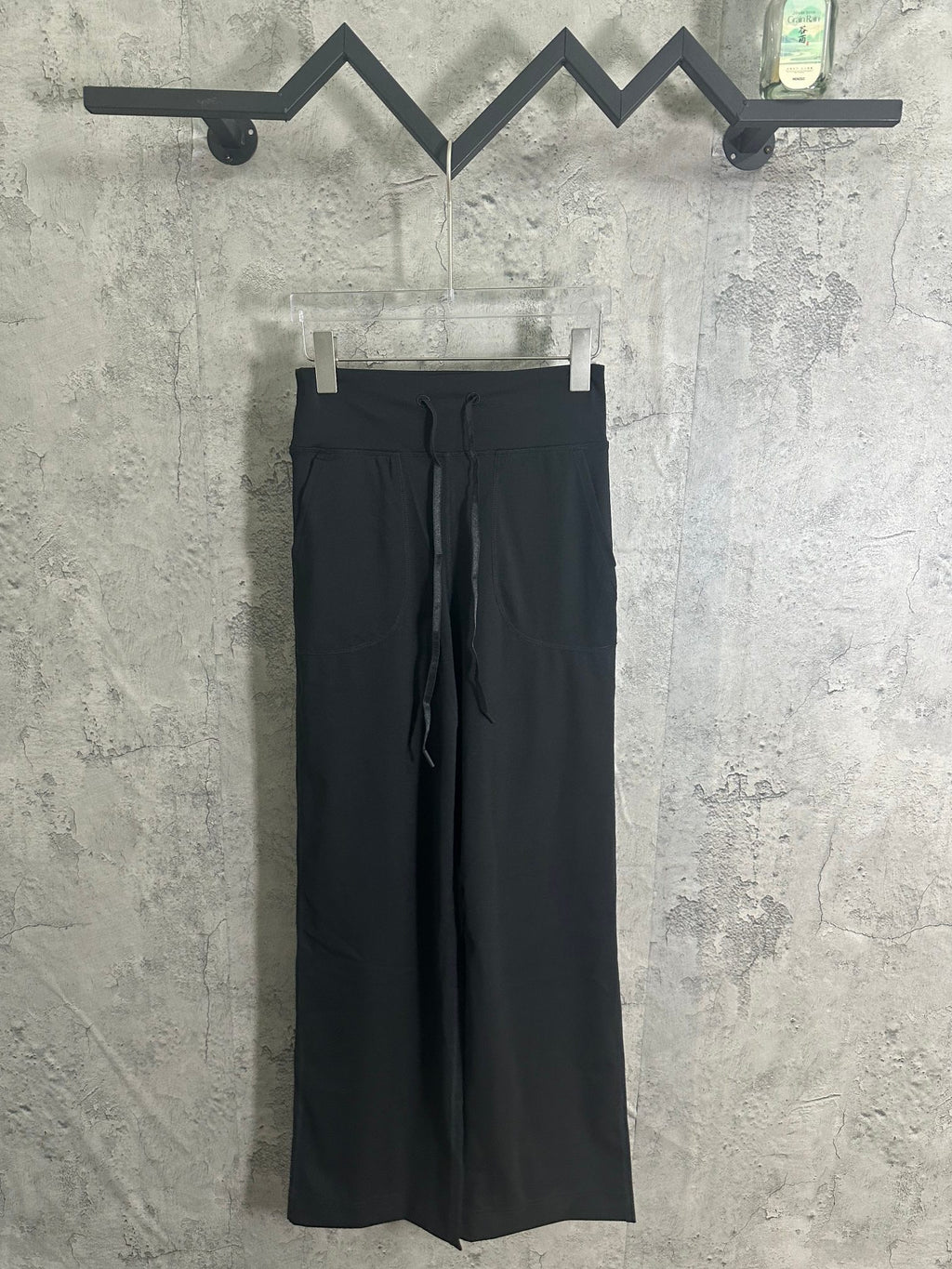 Black drawstring wide-leg pants with side pockets