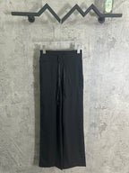 Black drawstring wide-leg pants with side pockets