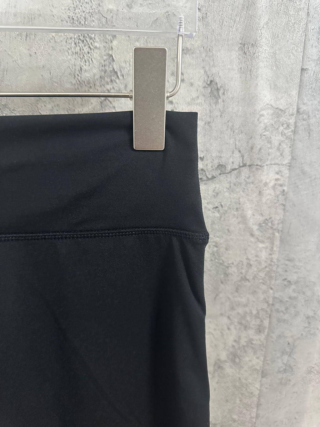 Black pants back waist with stitched waistband and belt loop