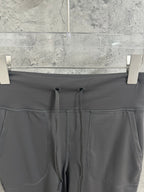 Drawstring waistband close-up with two cords and stitched front seam