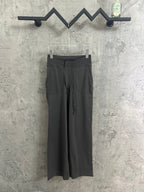 Dark gray drawstring pants with elastic waistband and side pockets