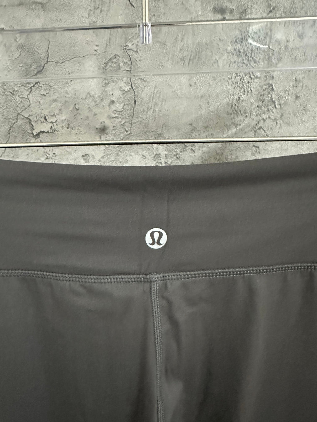 Dark gray pants waistband logo and center seam detail