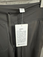 Drawstring pants with hang tag on waistband and front drawcord