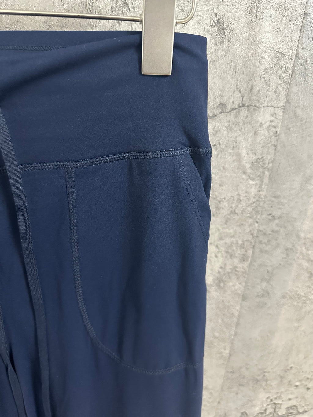 Navy pants with front pocket and angled side seam detail