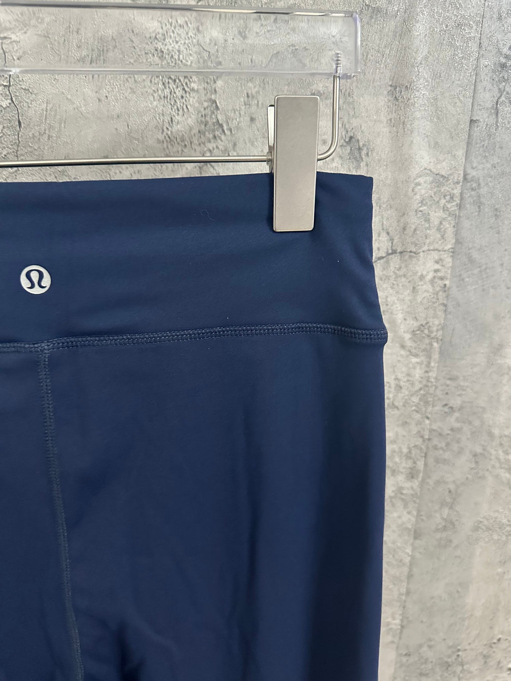 Navy pants with lululemon logo on waistband and front pocket
