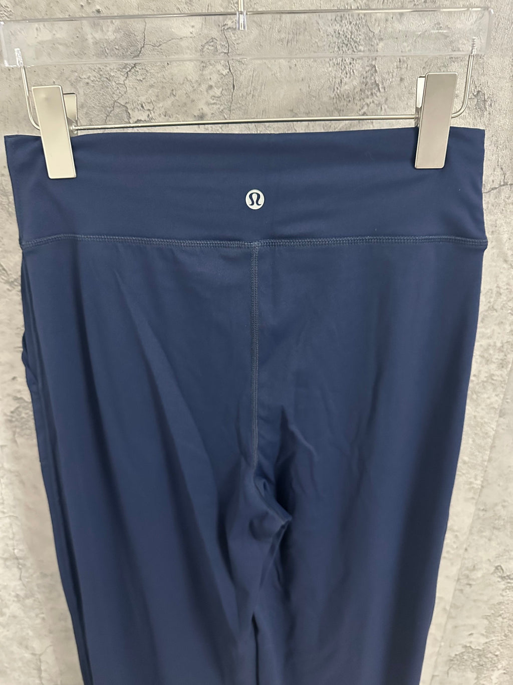 Ralph Lauren navy wide-leg pants with small oval logo on waistband
