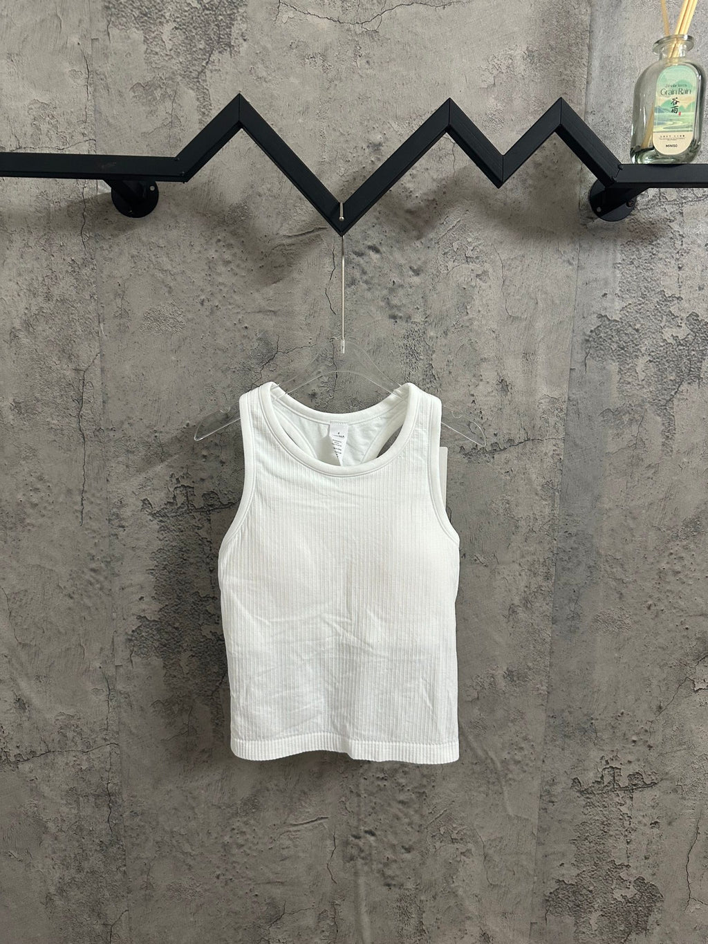 White ribbed knit tank top with scoop neckline
