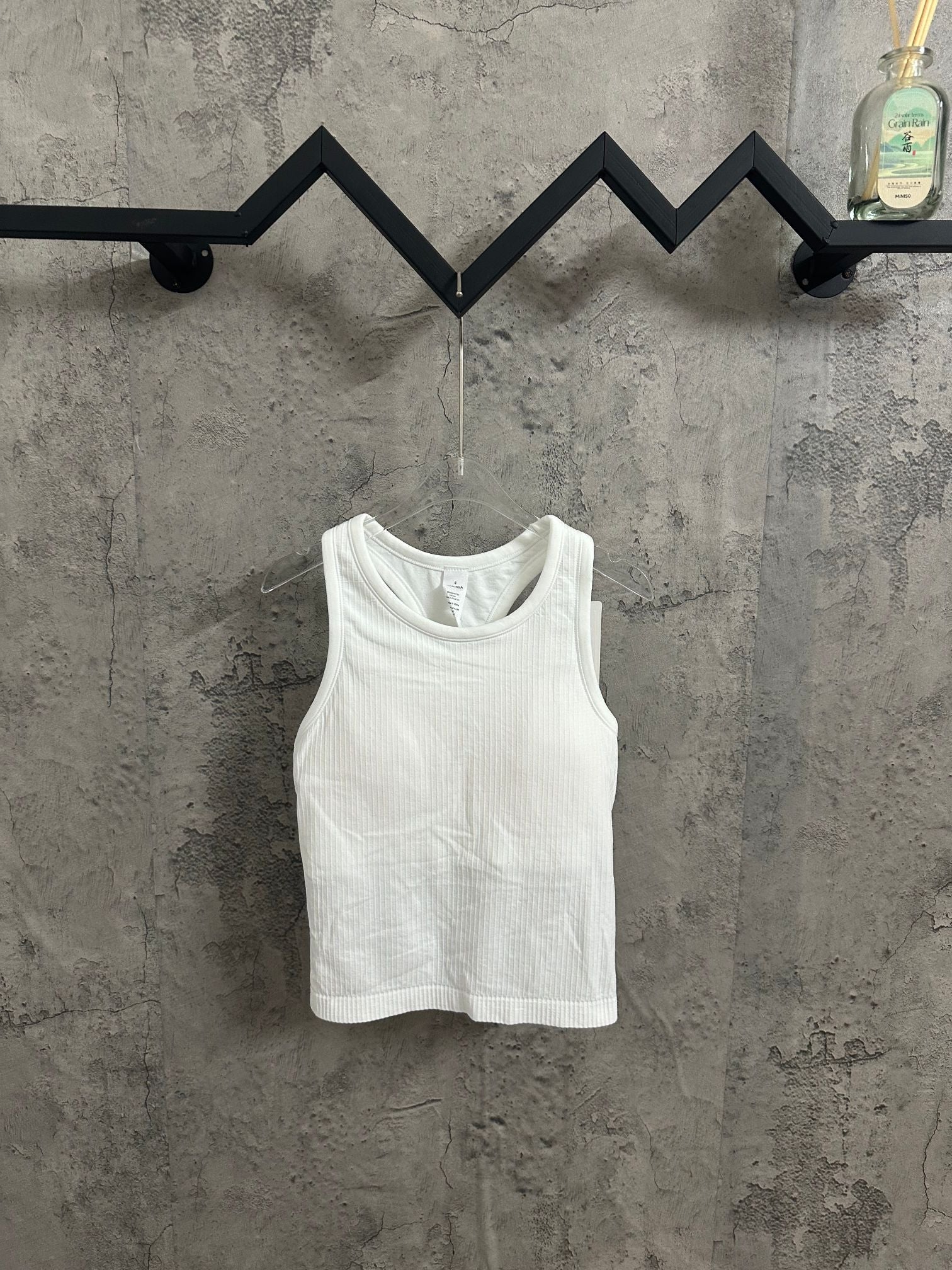White ribbed knit tank top with scoop neckline