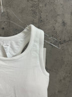 White sleeveless tank top close-up of ribbed knit scoop neckline