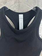 Black ribbed tank top neckline with interior brand label