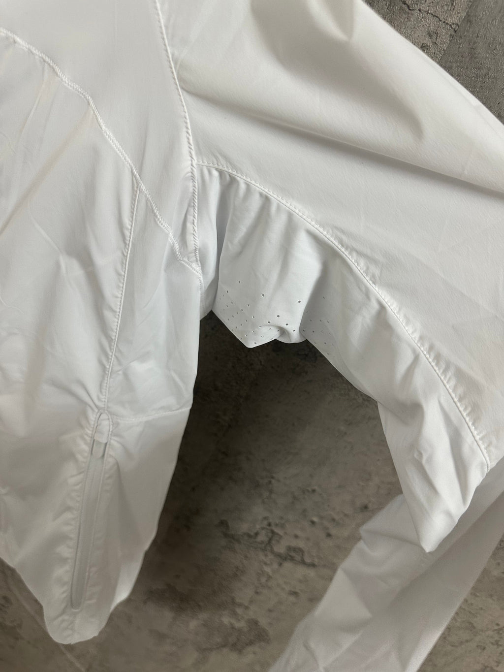 White hooded jacket sleeve and curved hem with elastic cuff