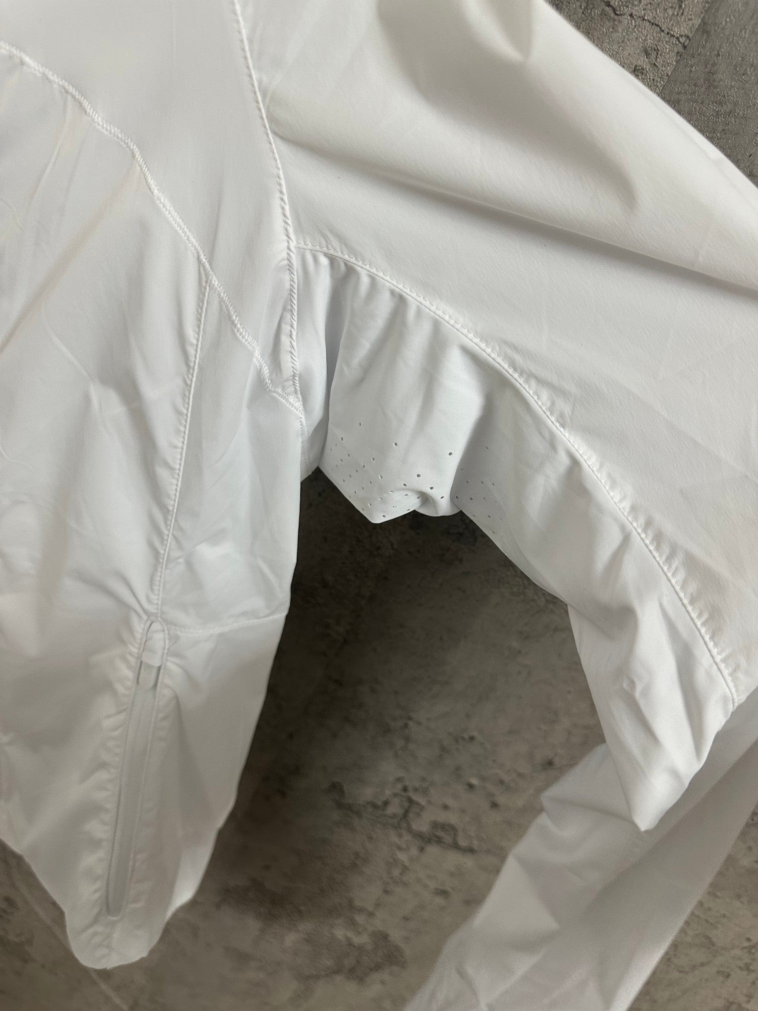 White hooded jacket sleeve and curved hem with elastic cuff
