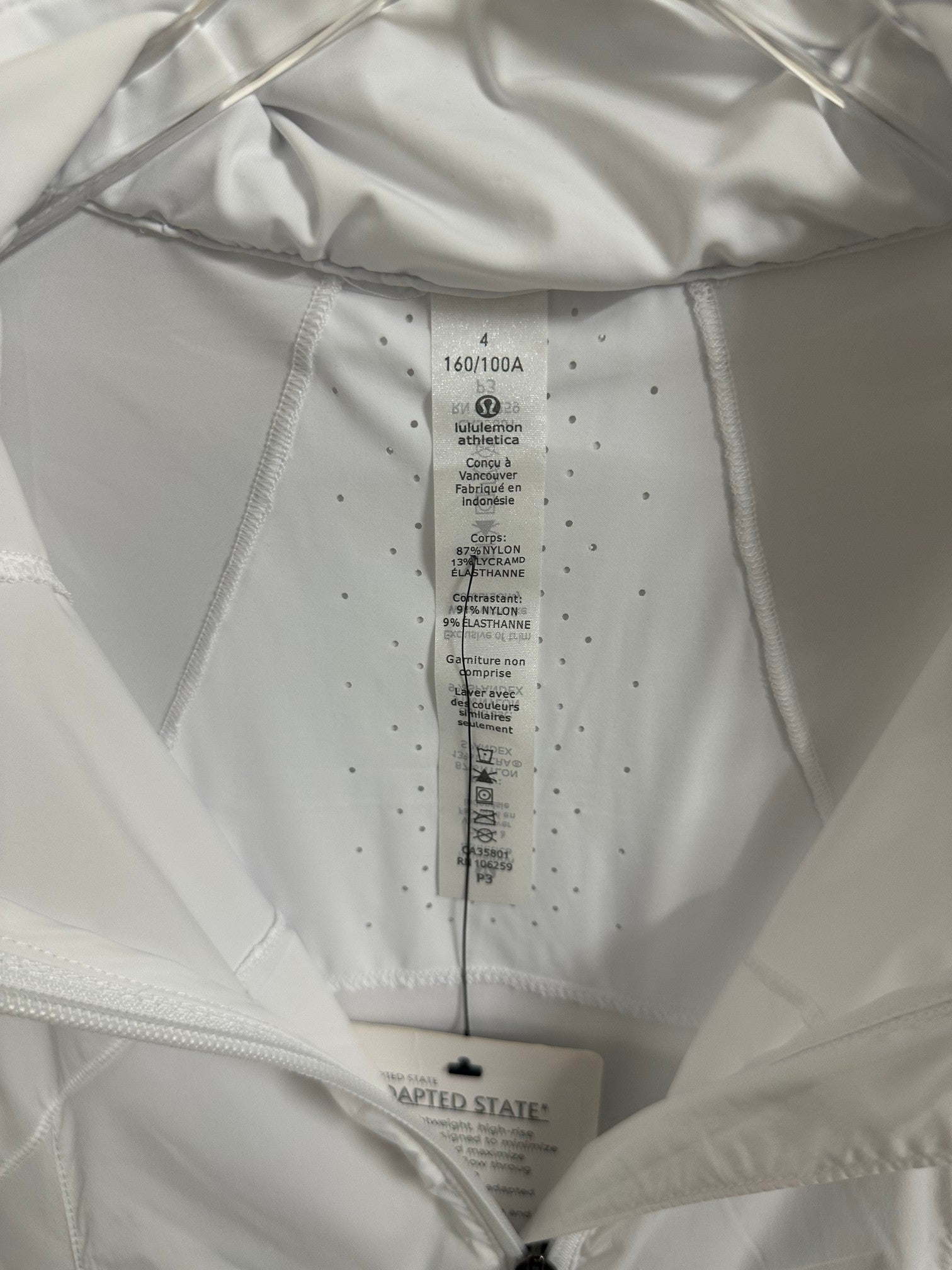 White jacket interior care label and size tag