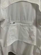 White jacket chest pocket with zipper and stitched panel detail