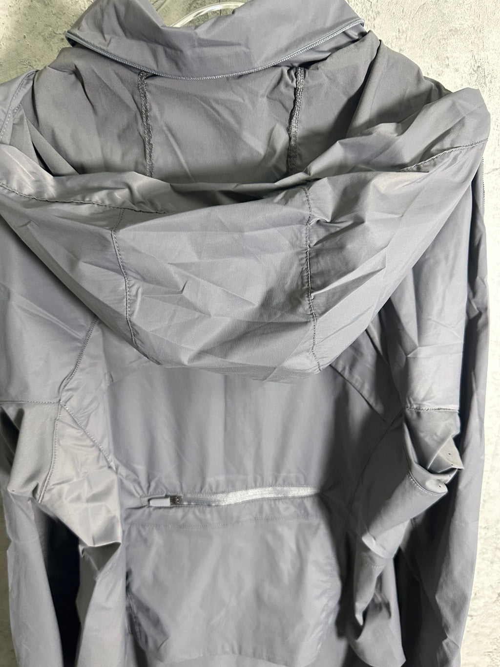 Ralph Lauren gray hooded jacket back view with folded hood and seams