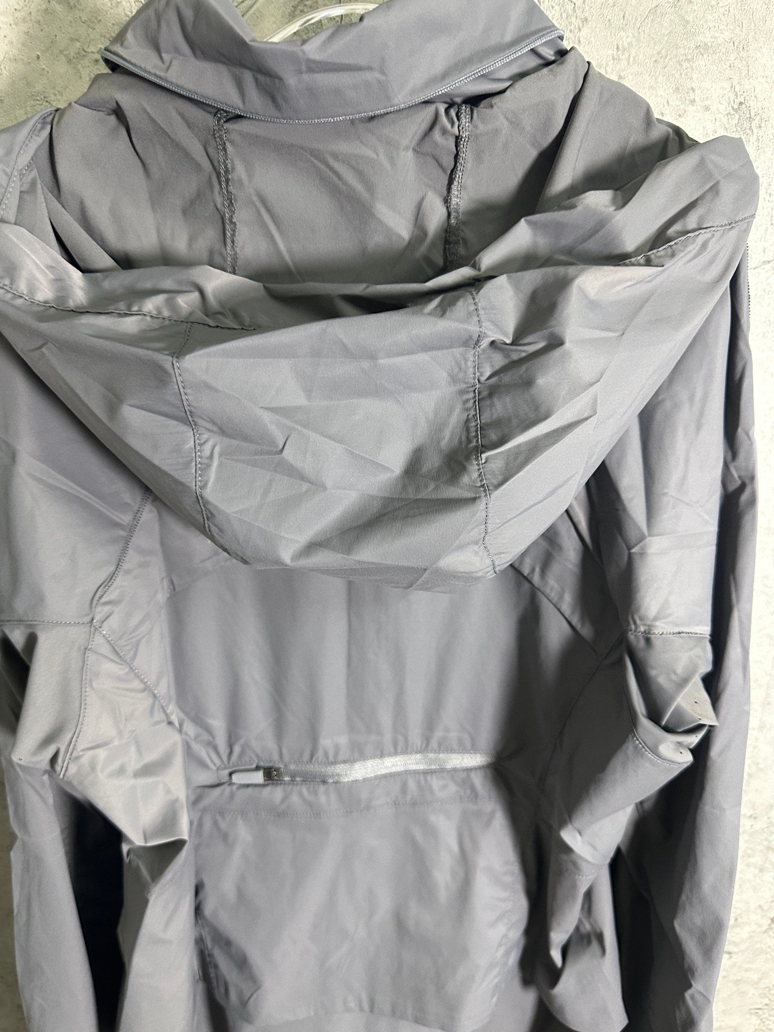 Ralph Lauren gray hooded jacket back view with folded hood and seams
