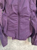 Purple windbreaker jacket with center zipper and two chest pockets