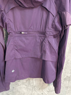 Purple windbreaker jacket interior view with drawcord waist
