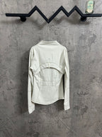 White jacket front view with high neck and long sleeves, seam details