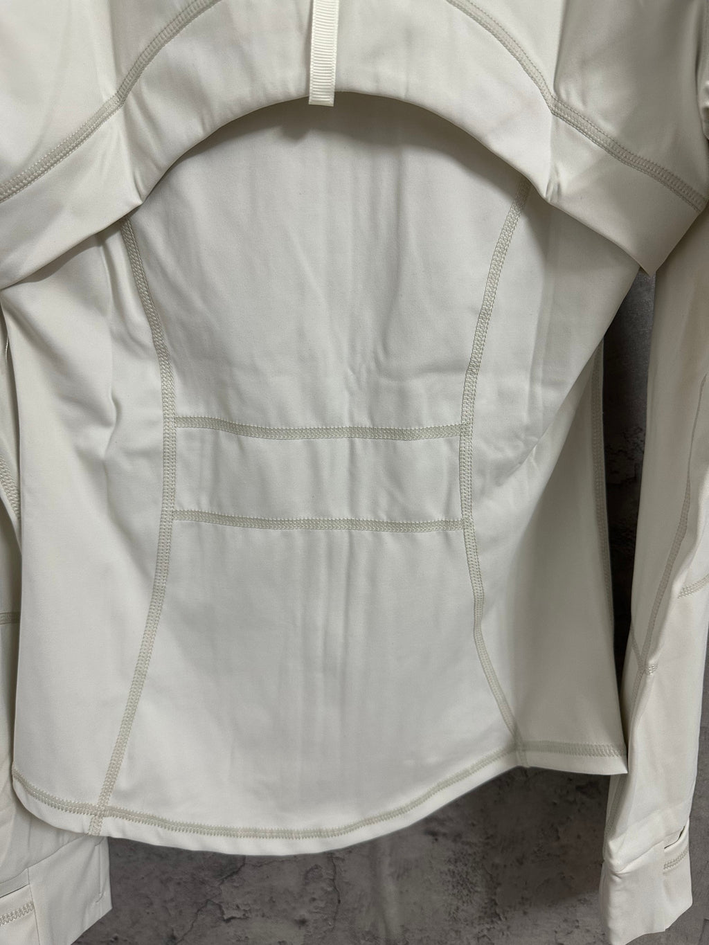 Ralph Lauren white jacket back close-up with yoke seam and pocket panel