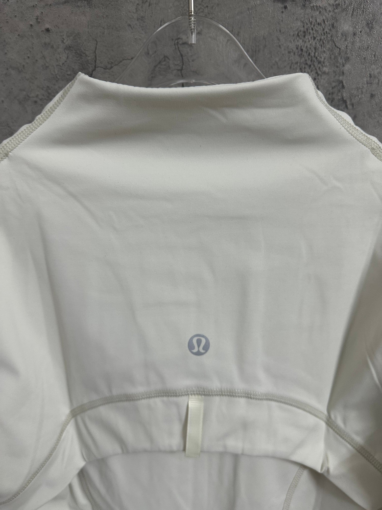 Ralph Lauren white jacket back view with small logo patch at center