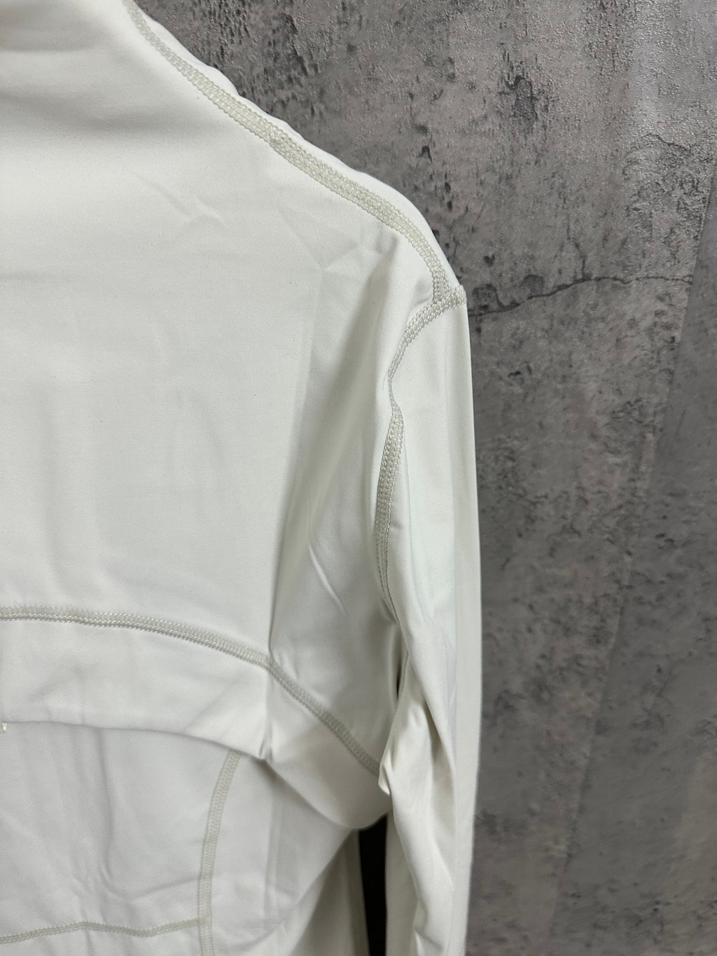Ralph Lauren white jacket side close-up with curved panel seam