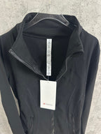 Black Ralph Lauren jacket on hanger with front zipper and attached product tag