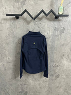 Navy jacket with stand collar and full-zip back view, gold zipper pull at center