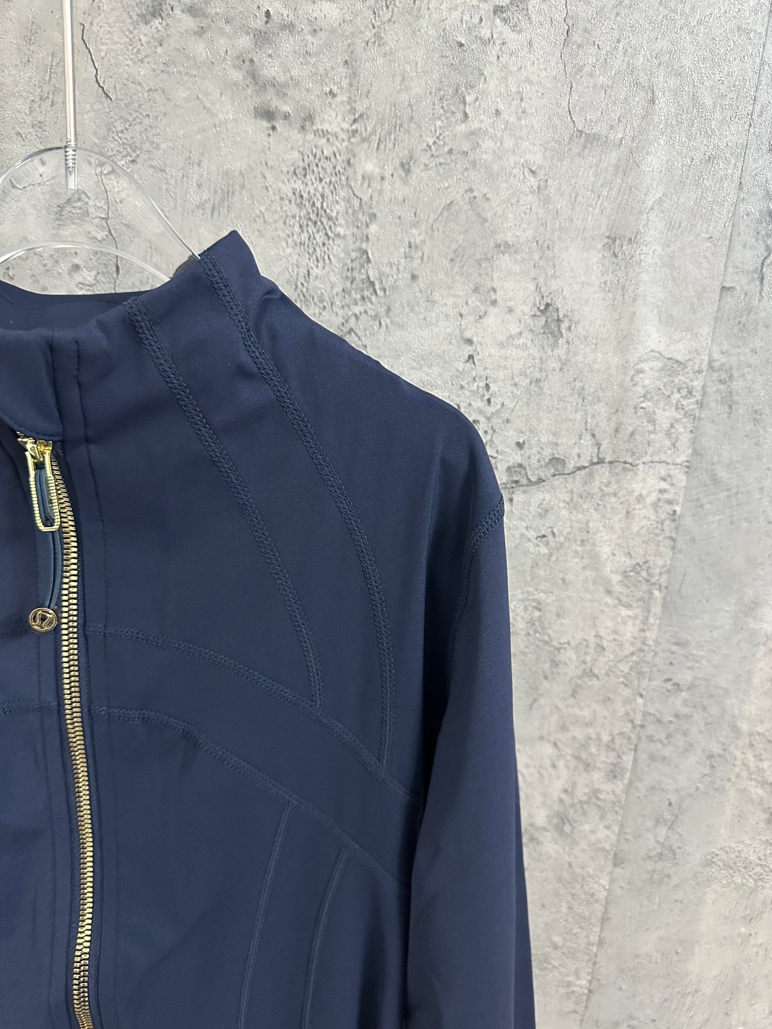 Ralph Lauren navy jacket close-up of shoulder and upper back seam detailing