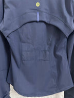 Ralph Lauren navy jacket upper back panel with small yellow logo and curved yoke seam
