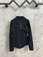 Black zip-front jacket, back view with gold-tone logo at upper back