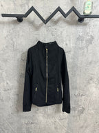 Black zip-front jacket with stand collar and gold-tone zipper pulls