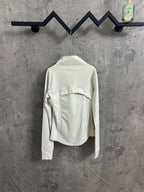 Light white zip-up jacket back view with stand collar and small gold logo at upper back.