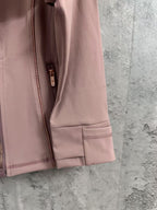 Dusty pink jacket sleeve cuff with stitched hem and side zipper edge