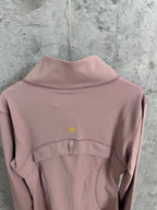 Dusty pink jacket back with small logo at upper back and stand collar