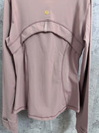 Dusty pink jacket back with arched yoke panel and curved seam details