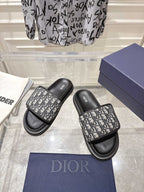 Dior slide sandals, black soles and straps with gray Dior-oblique monogram pattern