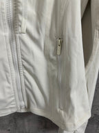 Cream hooded jacket with center front zipper and metal pull tab