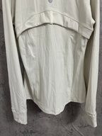 White hooded jacket back view with curved hem and hood yoke stitching detail.